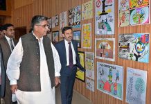 DG NAB Multan Fiaz Ahmad Qureshi viewing the paintings at Bahauddin Zakariya University organized by NAB