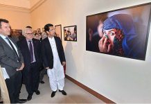 Shahram Khan Tarakai KP Minister for Elementary & Secondary Education and German Ambassador to Pakistan Alfred Grannas viewing the photographic exhibition on "Pakistan Merged Areas a Tribal Society on its way to Local Governance" at Pakistan National Council of Arts