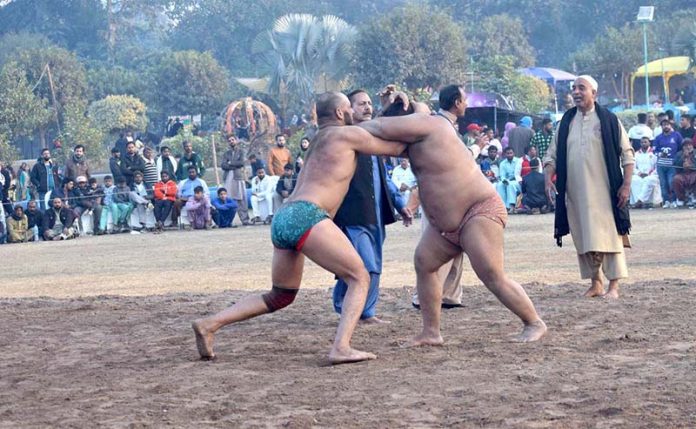 A view of traditional desi dangal (wrestling) Game of glimpse into past at Winter Family Festival organized by PHA