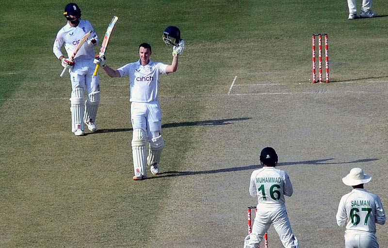 England's Harry Brook celebrates after scoring a century (100 runs) during the second day of the third cricket Test match between Pakistan and England at the National Cricket Stadium
