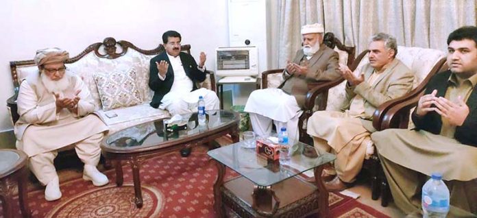 Chairman Senate, Muhammad Sadiq Sanjrani and senators offering fateha on the sad demise of the mother of leader of the opposition in Khyber Pakhtunkhwa Assembly, Akram Khan Durrani at his residence