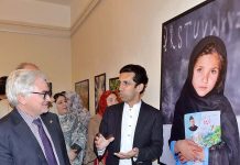 Shahram Khan Tarakai KP Minister for Elementary & Secondary Education and German Ambassador to Pakistan Alfred Grannas viewing the photographic exhibition on "Pakistan Merged Areas a Tribal Society on its way to Local Governance" at Pakistan National Council of Arts