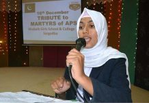 A girl is addressing to tribute martyrs of APS Peshawar at Khubaib Girls School and College