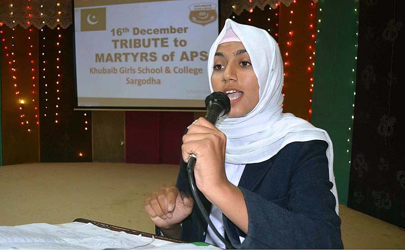 A girl is addressing to tribute martyrs of APS Peshawar at Khubaib Girls School and College