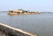 A view of submerged houses after four months of flash flood water as millions of houses and roads damaged and washed away due to deadly flood hit the area of Dil Murad Khokhar Village near City