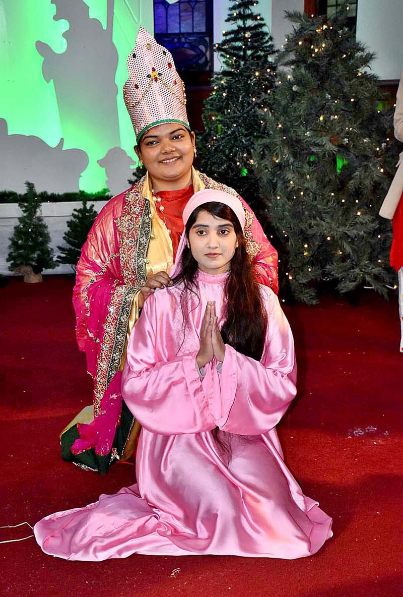 Girls performing religious rituals for upcoming Christmas at Local Church