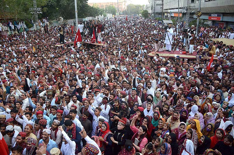 Girls enjoy on the cultural music during the occasion of Sindhi Cultural Day outside the Karachi Press Club.