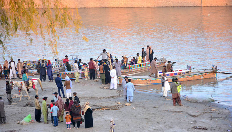 Families enjoys boat riding at the Indus River near jamshoro