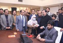 Managing Directors PBM, Amir Fida Paracha presenting the Initial payment to a widow in the Launching Ceremony of “Orphans & Widows Support Program”.