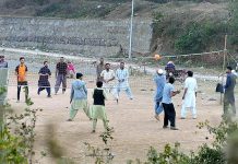 Youngsters playing volleyball at a local park in Bhara Kaho
