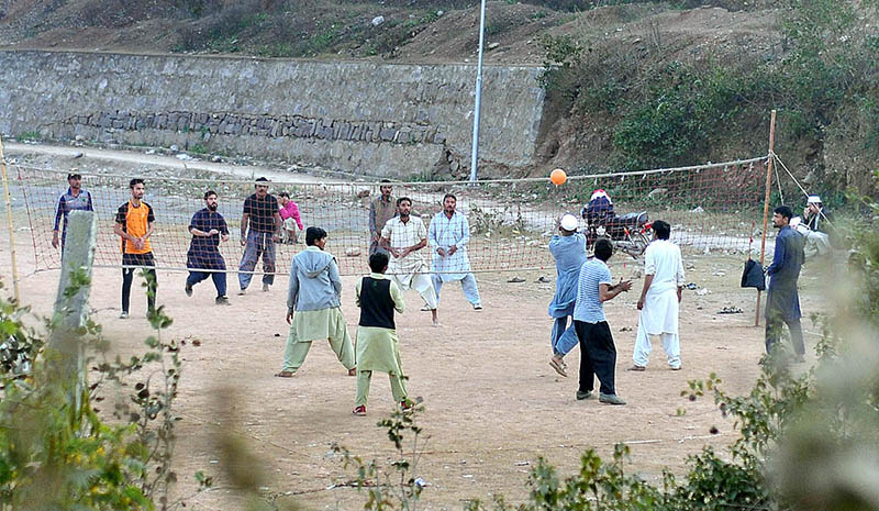 Youngsters playing volleyball at a local park in Bhara Kaho
