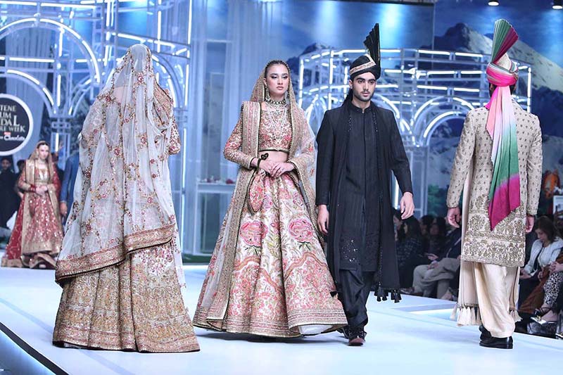 Models walk on the ramp during the 1st day of the 20th edition of the Pantene Hum Bridal Couture Week