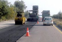 Heavy machinery is being used for carpeting new asphalt road at Motorway near Karnal Sher Khan Interchange