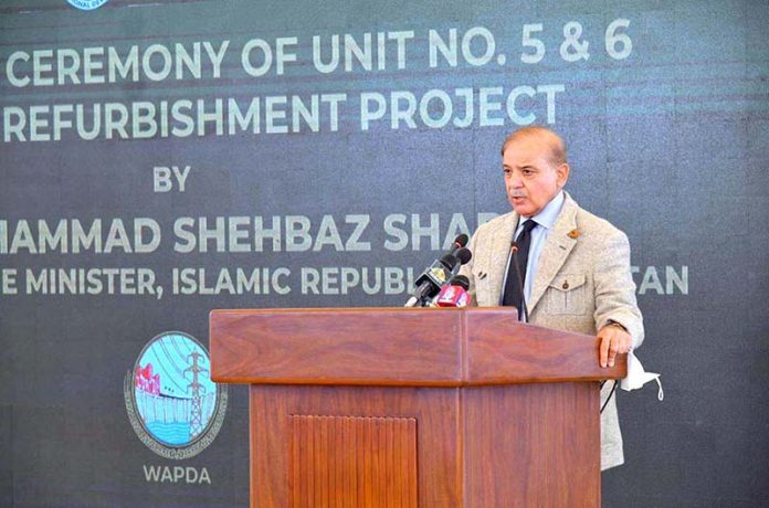 Prime Minister Shehbaz Sharif addresses the inaugural ceremony of the refurbishment of unit 5 and 6 of Mangla Dam