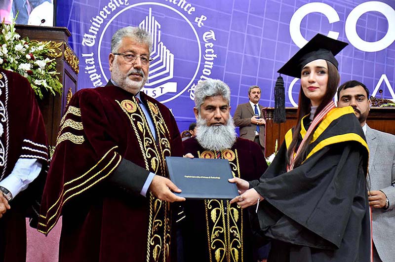 Chairman Higher Education Commission Dr. Mukhtar Ahmad distributing certificates to students during convocation of Capital University of Science and Technology at Jinnah Convention Center.