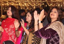 Women enjoying traditional song during last day of 8th Ayaz Melo ceremony organized by Khanabadosh Writers Café at Sindh Museum.