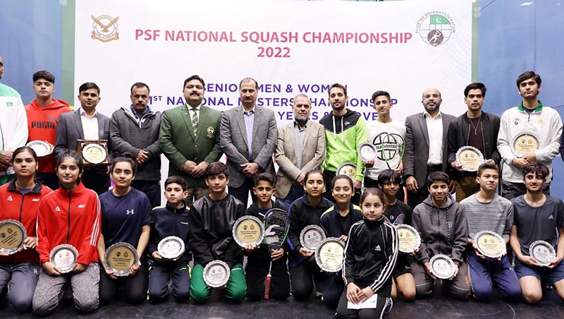 Squash Legend Mr Jansher Khan in a group photograph with the winners of PSF-National Squash Championship-2022 at Mushaf Squash Complex