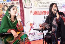 Students singing a cultural song during Cultural Programme in connection with upcoming Sindhi Ajrak Topi Culture Day at Sindh University Campus