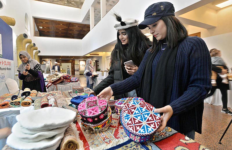 Girls visiting stalls during closing ceremony of 12th Pakistan Mountain Festival organized by Devcom-Pakistan and Pakistan National Council of the Arts