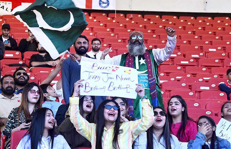 Spectators enjoy during the 3rd cricket test match played between Pakistan and England teams at the National Cricket Stadium