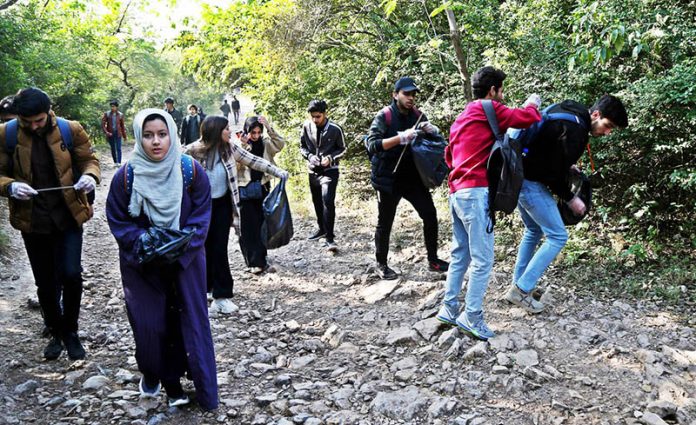 Youth cleaned up Margalla Hills Trail-5 during 12th Pakistan Mountain Festival organized by Devcom-Pakistan and IWM