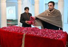 Chairman Pakistan People's Party and Foreign Minister Bilawal Bhutto Zardari showering flowers at the grave of former Prime Minister Shaheed Mohtarma Benazir Bhutto at Garhi Khuda Bakhsh