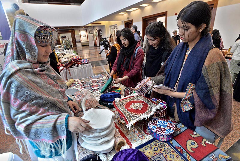 Girls visiting stalls during closing ceremony of 12th Pakistan Mountain Festival organized by Devcom-Pakistan and Pakistan National Council of the Arts