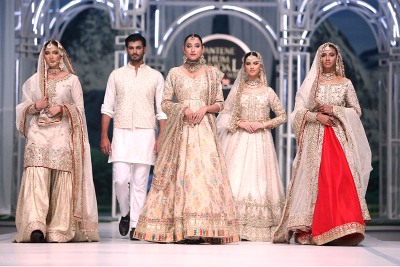 Models walk on the ramp during the 2nd day of the 20th edition of the Pantene Hum Bridal Couture Week