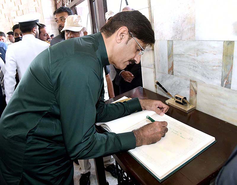 Sindh Chief Minister Syed Murad Ali Shah records his impressions in the visitors’ book opened at Mazar of Quaid-e-Azam Mohammad Ali Jinnah on the occasion of the 146th birth anniversary of the father of the nation.