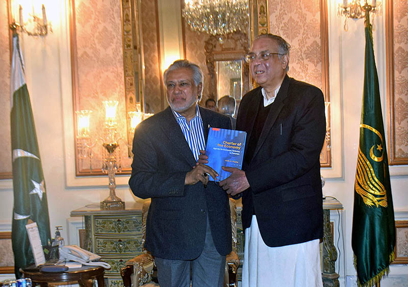 Famous Businessman SaifUllah Dogar presenting his book to Finance Minister Ishaq Dar.