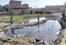 A view of stagnant sewerage water accumulated at New Shabahz Colony near Miro Khan Chowk creating problems for pedestrians and needs the attention of the concerned authorities