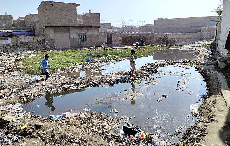 A view of stagnant sewerage water accumulated at New Shabahz Colony near Miro Khan Chowk creating problems for pedestrians and needs the attention of the concerned authorities