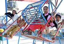 Children enjoying swing at a local park near Otha Chowk