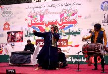 Abbas Jatt folk singer performing on the stage during Family Cultural Festival "Jungel main mungal" organized by department of information and culture at