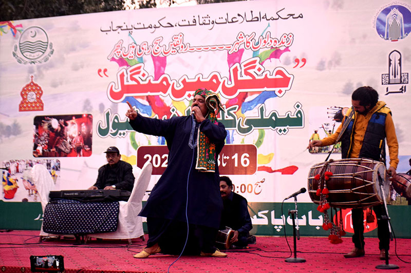 Abbas Jatt folk singer performing on the stage during Family Cultural Festival "Jungel main mungal" organized by department of information and culture at