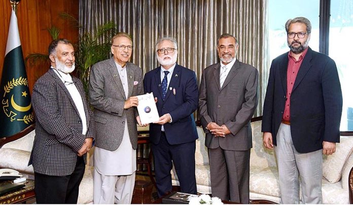 Member of the Order of The British Empire, Toaha Bashir Qureshi along with his delegation presenting his book “Qiyam-e-Amn aur Aqwam-e-Alam” to President Dr. Arif Alvi at Aiwan-e-Sadr