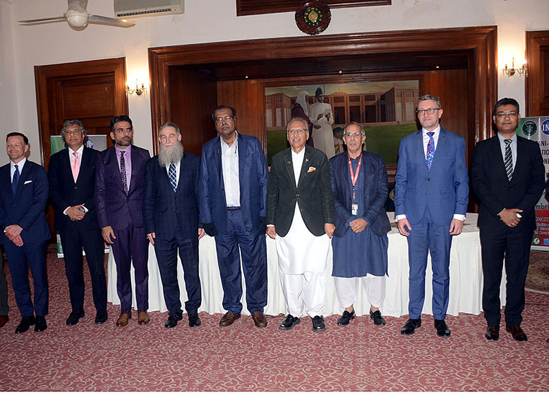 KARACHI: December 05 - A group photo along with President of Pakistan Dr. Arif Alvi during the Inauguration of 1st Pakistan Polish International Scientific Conference organized by Federal Urdu University at Governor House-APP