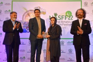 Federal Minister for Information Marriyum Aurangzeb giving souvenir to famous actor Farhan Ali Agha during National Amateur Short Film Festival Award distribution Ceremony at PM Secretariat.