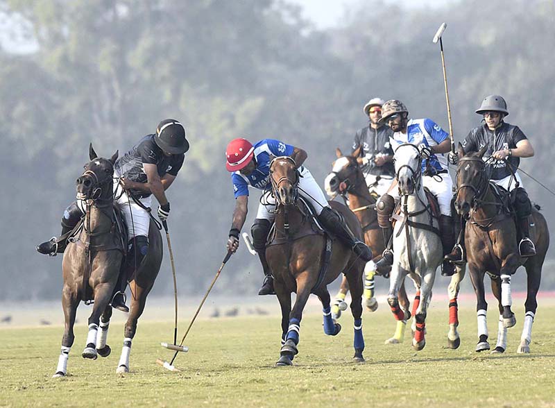 Polo match playing between Diamond Paints Newage Cables Master Paints in Coca Cola Lahore Open Polo Championship 2022 at Lahore Polo Club