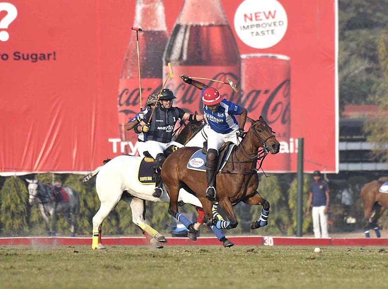 Polo match playing between Diamond Paints Newage Cables Master Paints in Coca Cola Lahore Open Polo Championship 2022 at Lahore Polo Club