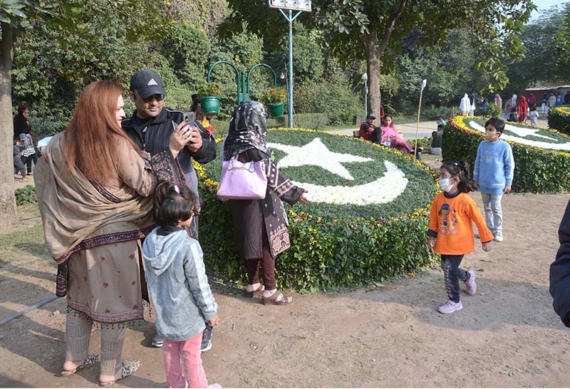 Many families stroll through the colorful styles of flowers during the various flower displays organized by the PHA at Jilani Park