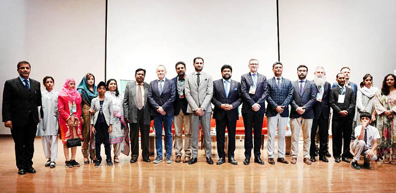 Shield is being presented to Governer Sindh Kamran Khan Tesuri on the ending session of Pak-Poland Two Days International Conference.