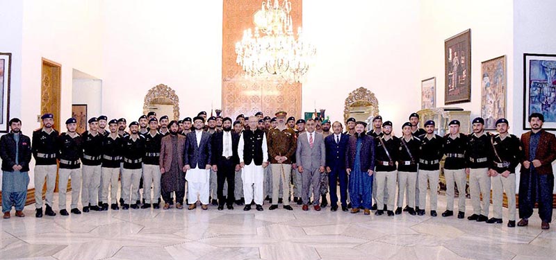 President Dr. Arif Alvi in a group photo with a delegation of students and staff of the Cadet College, Killa Saifullah at Aiwan-e-Sadr