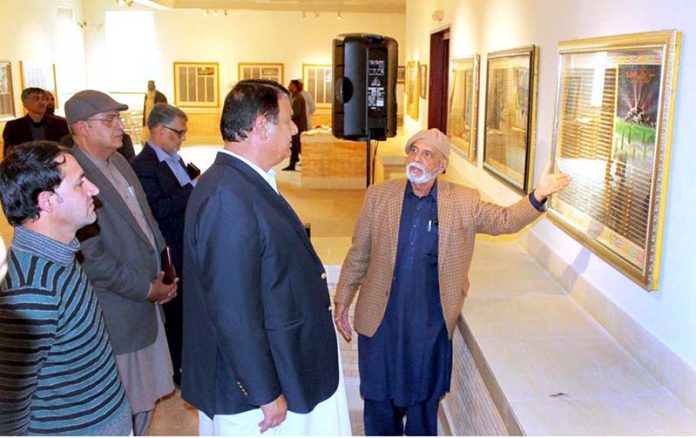 Adviser to the Prime Minister on National Heritage and Culture Division, Engr. Amir Muqam taking round of displayed frames at Special Quran Exhibition at PNCA