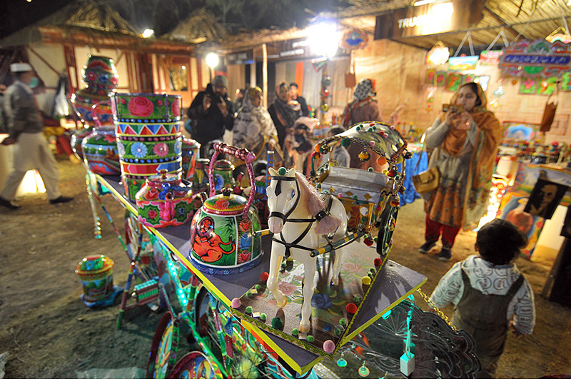 People visiting different stalls during “Folk Festival Lok Mela” at Lok Virsa