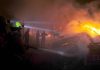 A view of weekly bazaar on fire and fire fighters are trying to extinguish the fire at G-9 Peshawar Morr