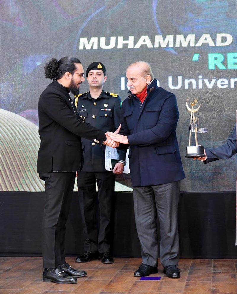 Prime Minister Muhammad Shehbaz Sharif giving Award to Muhammad Belaal Imran who won 1st position in Special Category of National Amateur Short Film Festival (NASFF) 2022