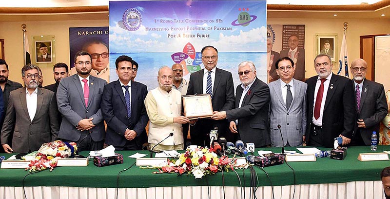 Federal Minister for Planning, Development and Special Initiatives, Prof. Ahsan Iqbal being presented with memento during his visit to Karachi Chamber of Commerce and Industry KCCI.