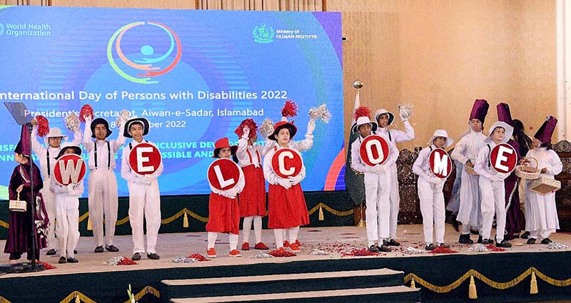 Children with different abilities performing a tableau at a ceremony in connection with the International Day of Persona with Disabilities at Aiwan-e-Sadr.