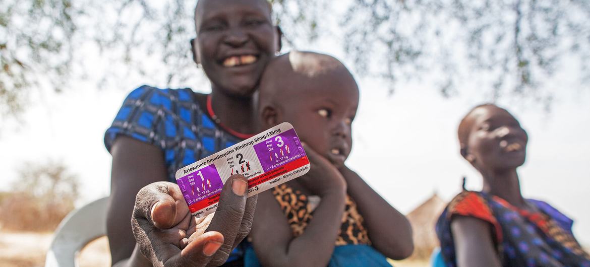 A woman receives medication to treat her four-year-old daughter who is suffereing from malaria in Jonglei State, South Sudan-UNICEF